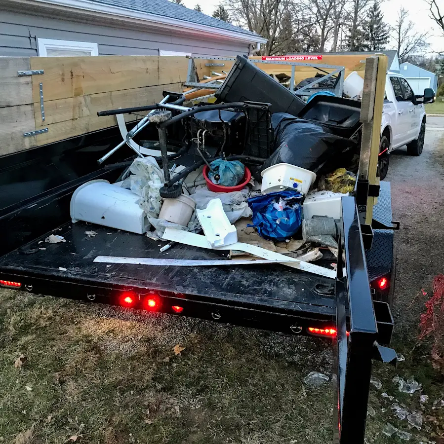 Roll-off dumpster delivered to a residential driveway in De Soto